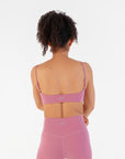 Back view of the Raspberry Scoop Bralette worn by a model