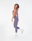  Three-quarter side view of the High-Rise Leggings in Acai