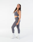 Side view of the Chia V-Waist Leggings worn by a model