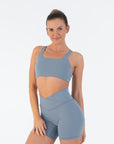 Front view of the Juniper Racerback Bra worn by a model