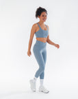 Side view of the Juniper V-Waist Leggings worn by a model