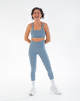  Model standing in the Juniper V-Waist Leggings in Juniper